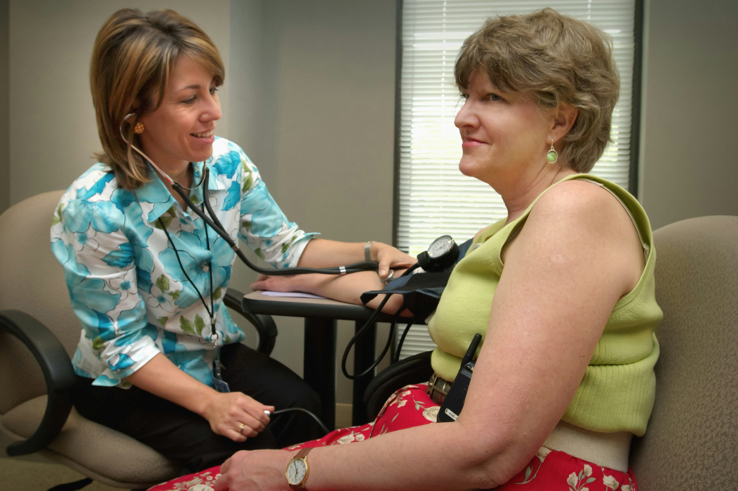 Photo of a doctor seeing an adult patient at Kentucky Urgent Care